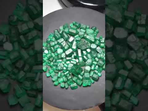 green gemstone emerald raw stone 